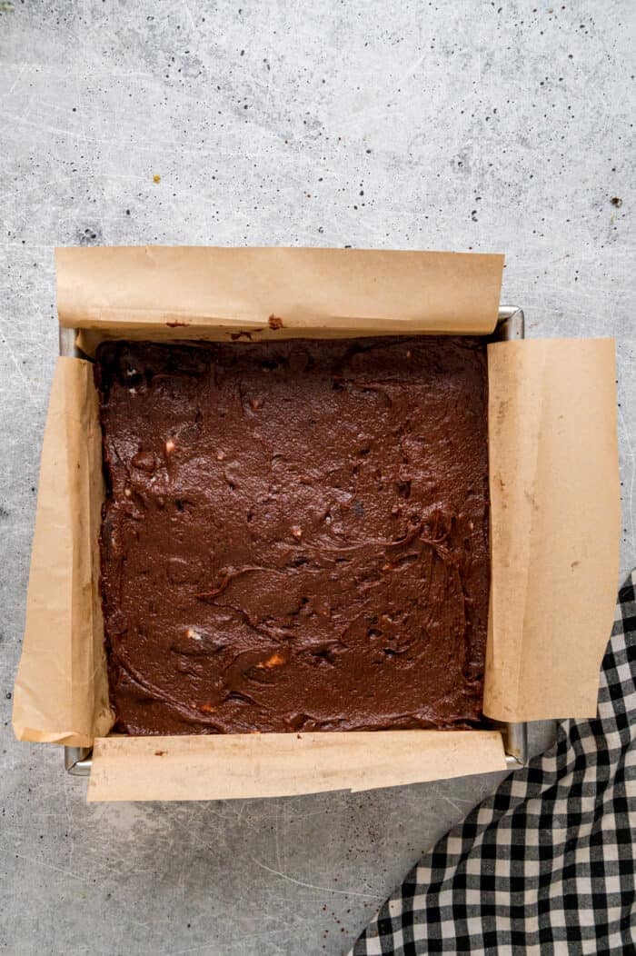 Oreo brownie batter in a square pan