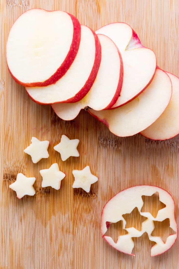 This 4th of July Fruit Salad is so festive and easy to make! It's perfect for Memorial Day, 4th of July or any patriotic gathering. apple slices cut into star shapes