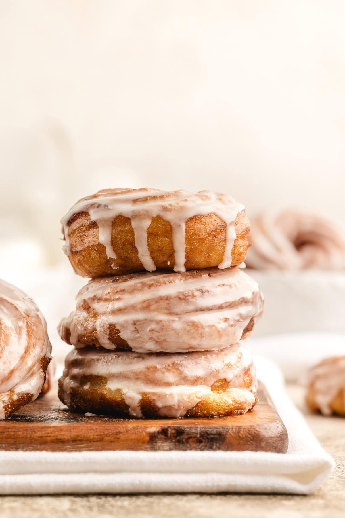 Side view of a stack of three French cruller donuts