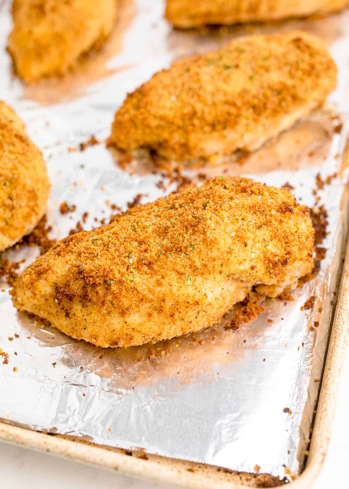 Shake and bake chicken on a baking sheet