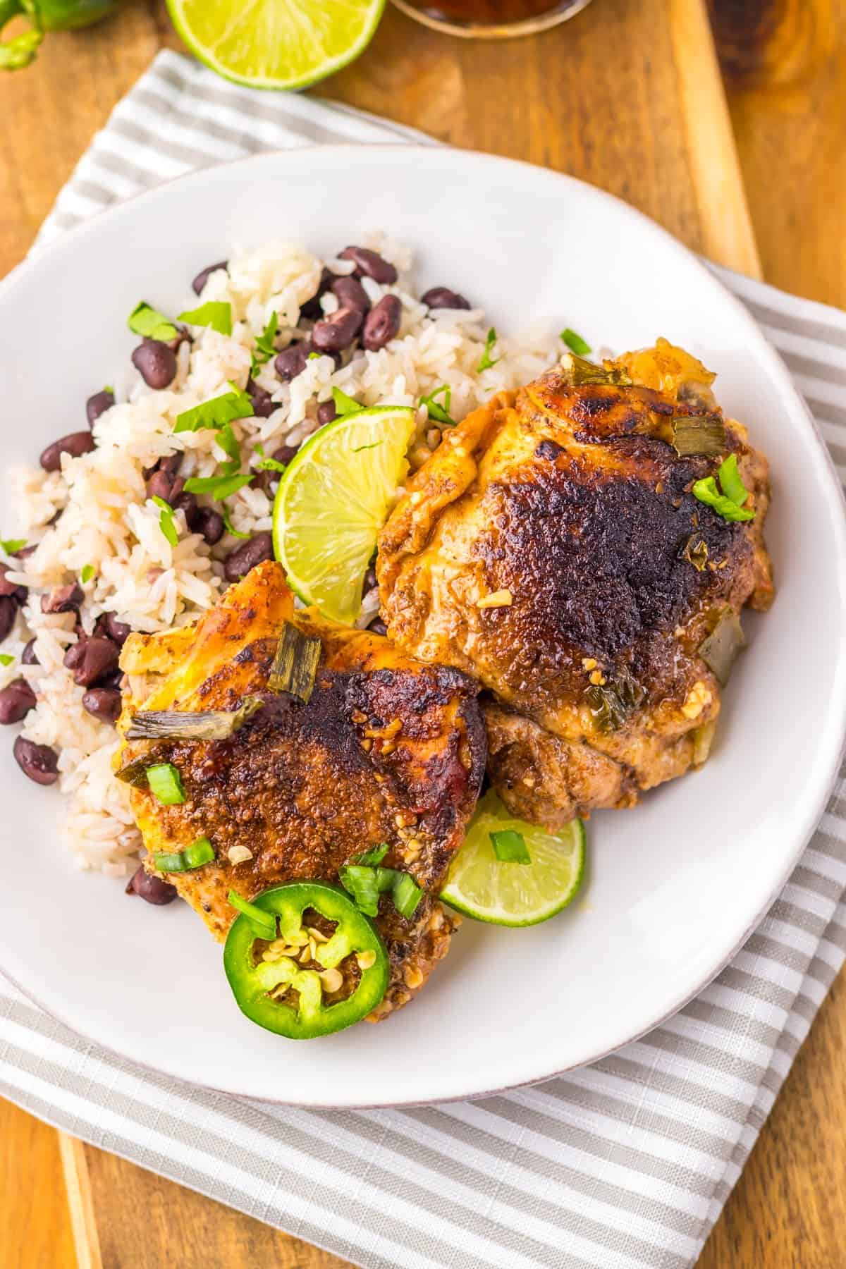 A plate of slow cooker jerk chicken with rice and beans
