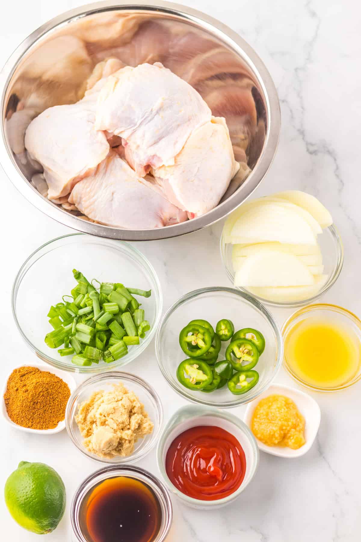 Overhead view of ingredients needed to make slow cooker jerk chicken