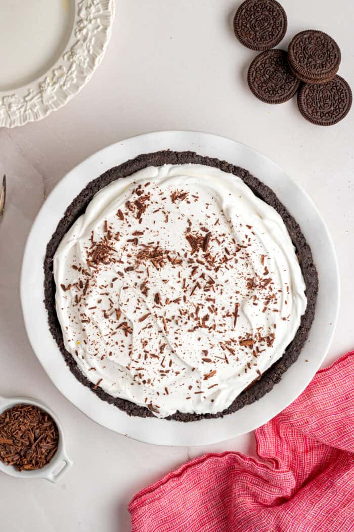 With a smooth, creamy filling in an Oreo crust, this Chocolate Pudding Pie is made in 15 minutes with 5 ingredients & 0 cooking or baking. Overhead view of no bake chocolate pudding pie