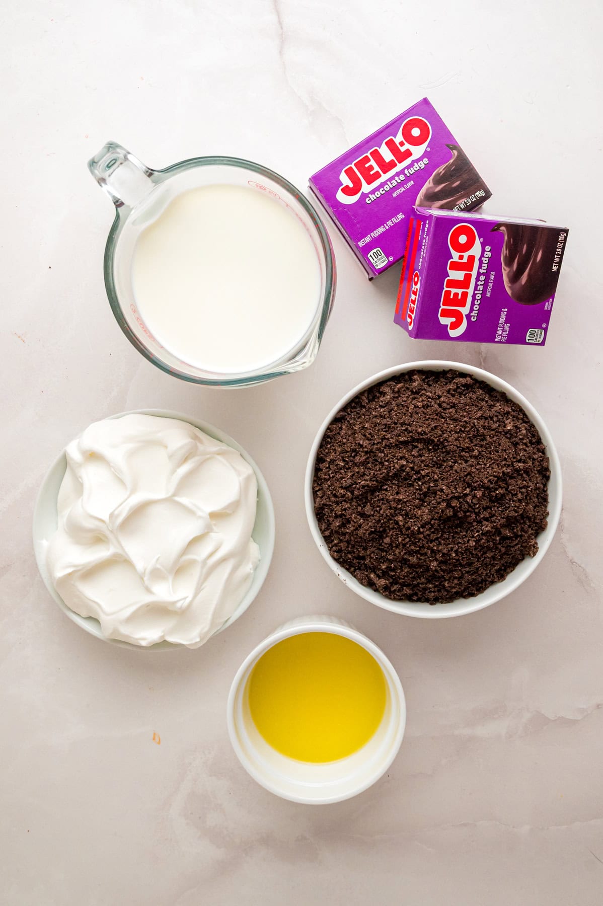 With a smooth, creamy filling in an Oreo crust, this Chocolate Pudding Pie is made in 15 minutes with 5 ingredients & 0 cooking or baking. Overhead view of chocolate pudding pie ingredients