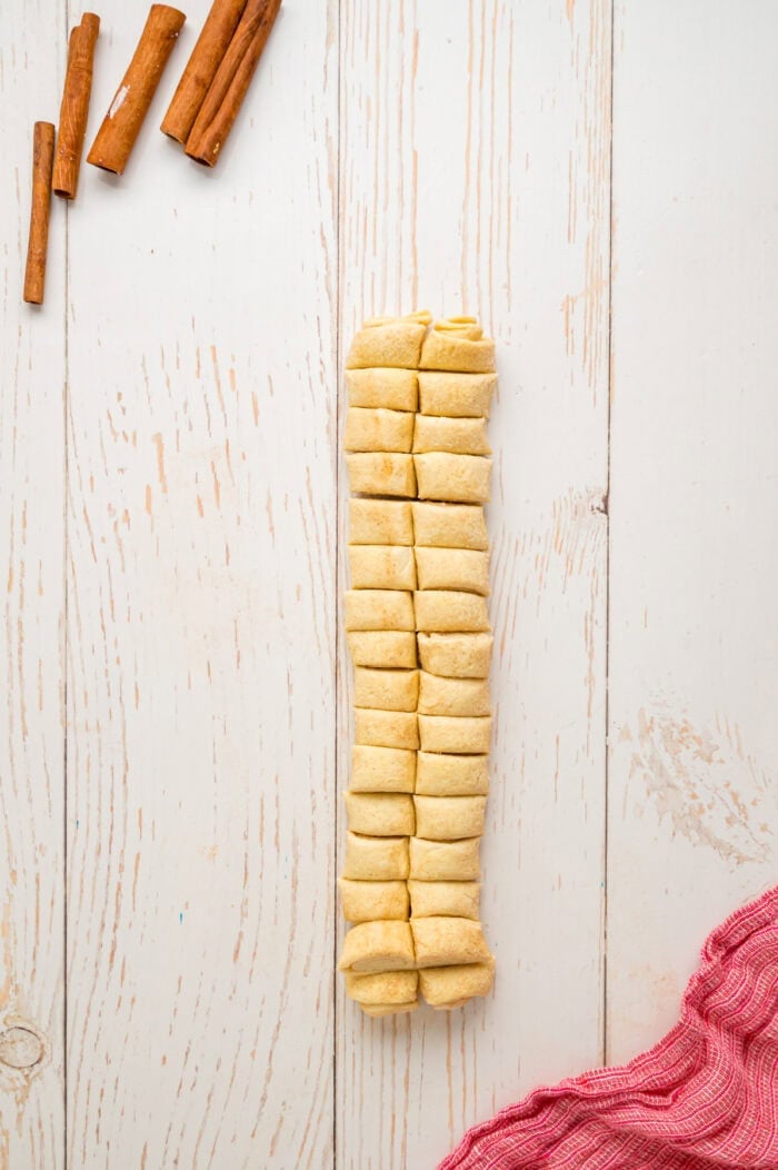 A log of puff pastry cut into slices