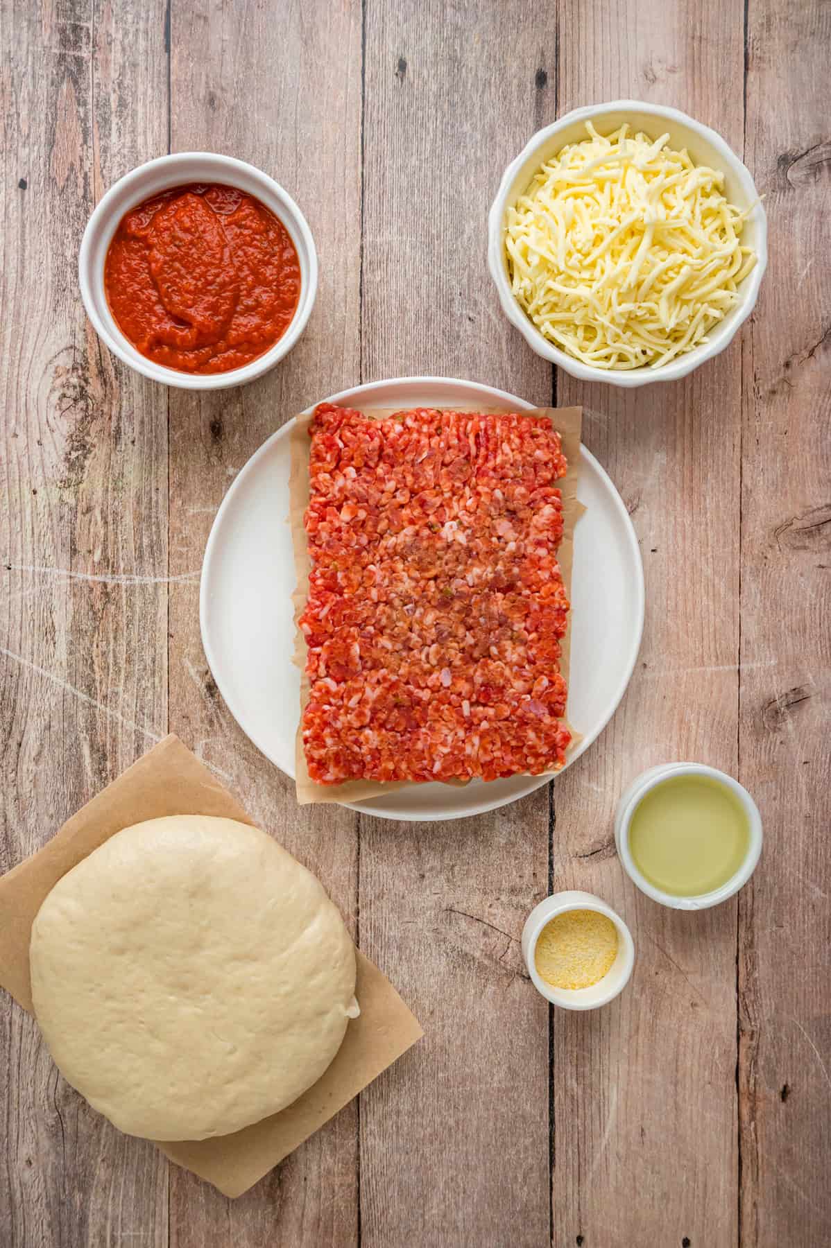 Overhead view of ingredients needed to make sheet pan pizza