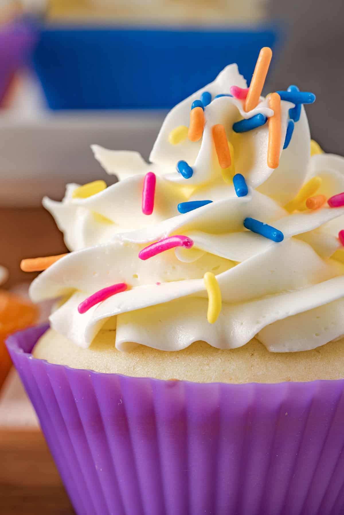 A vanilla cupcake topped with Italian meringue buttercream
