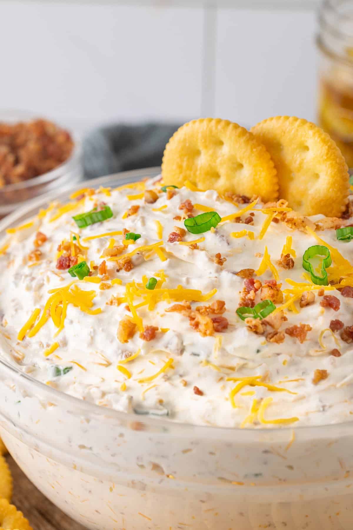 A bowl of million dollar dip with Ritz crackers
