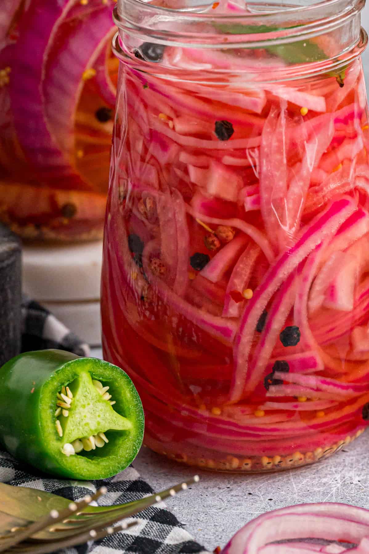 Close up of a jar of pickled red onions