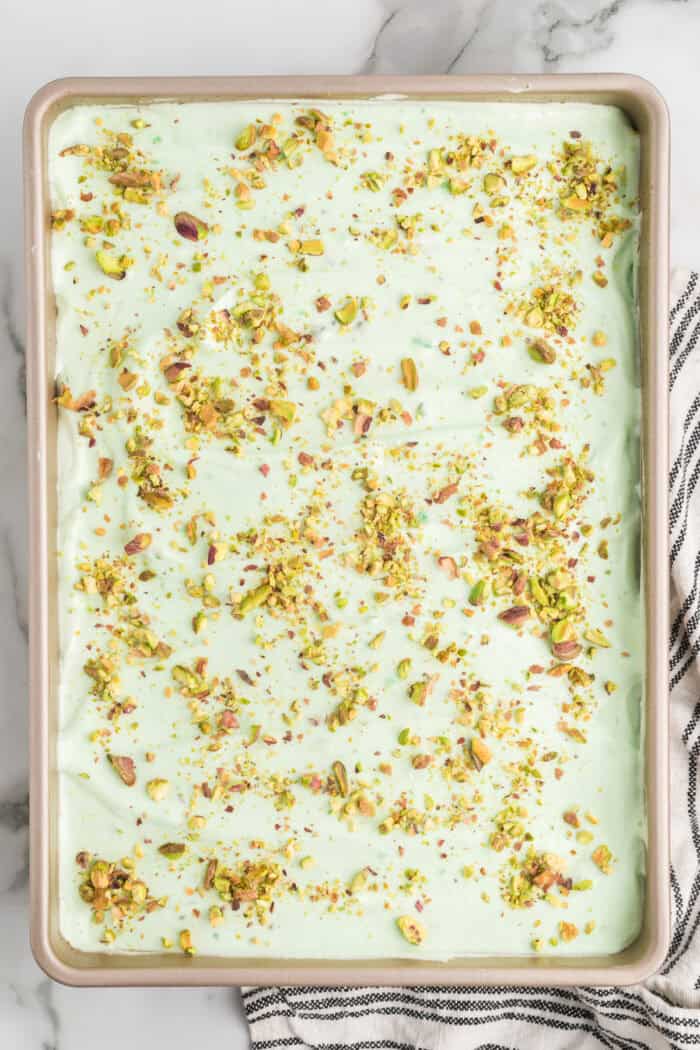 Overhead view of a pan of pistachio cake