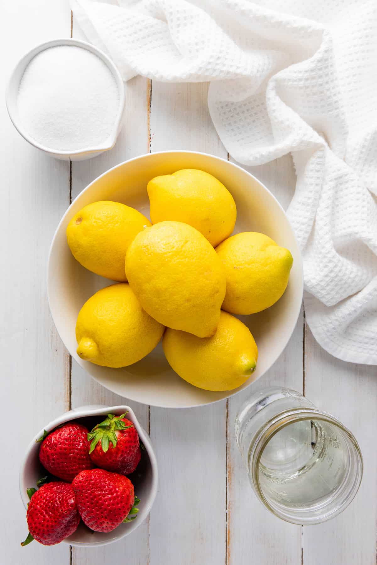 Overhead view of ingredients needed to make strawberry lemonade