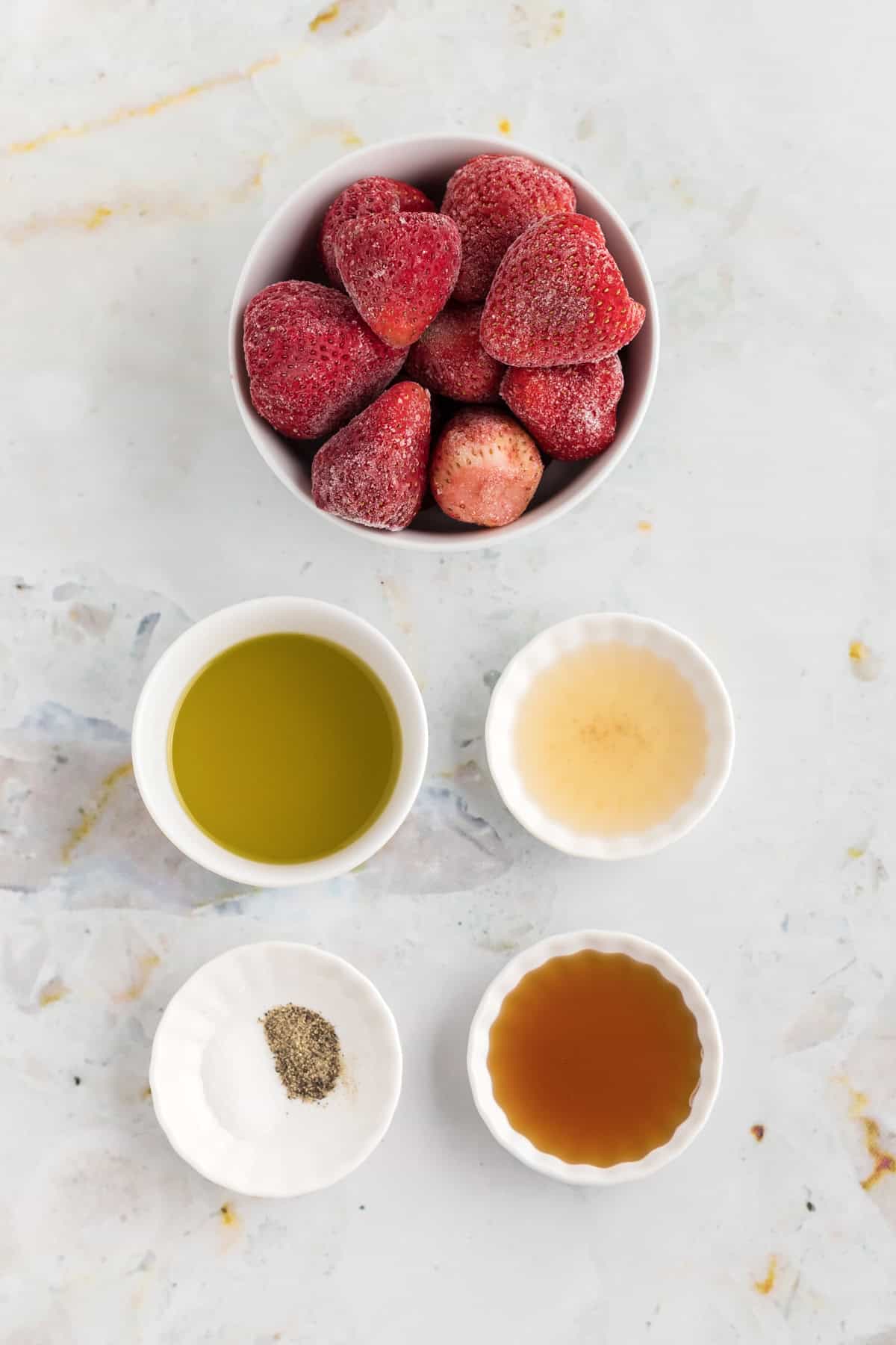 Overhead view of ingredients needed to make strawberry vinaigrette