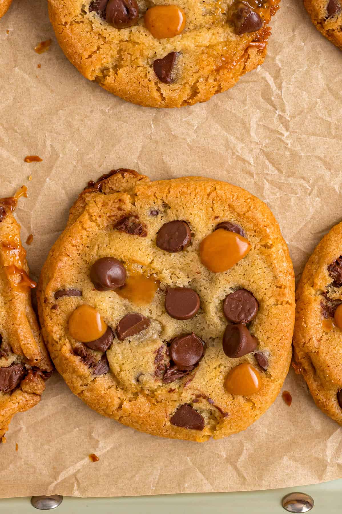 Overhead view of caramel chocolate chip cookies on a baking sheet