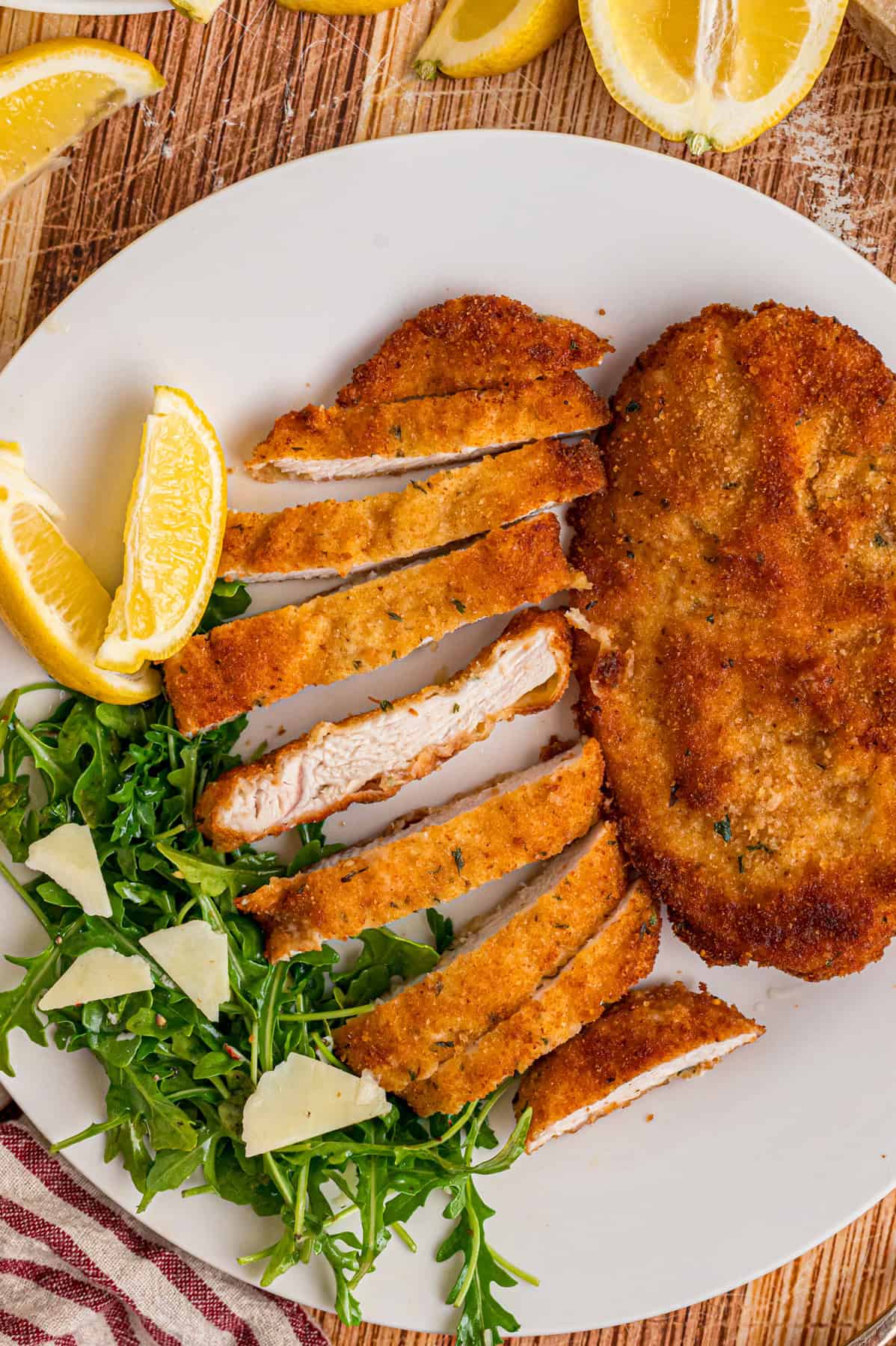 Chicken cutlets are coated in Italian breadcrumbs and quickly fried in this Chicken Milanese recipe. Quick & easy! A plate of chicken milanese