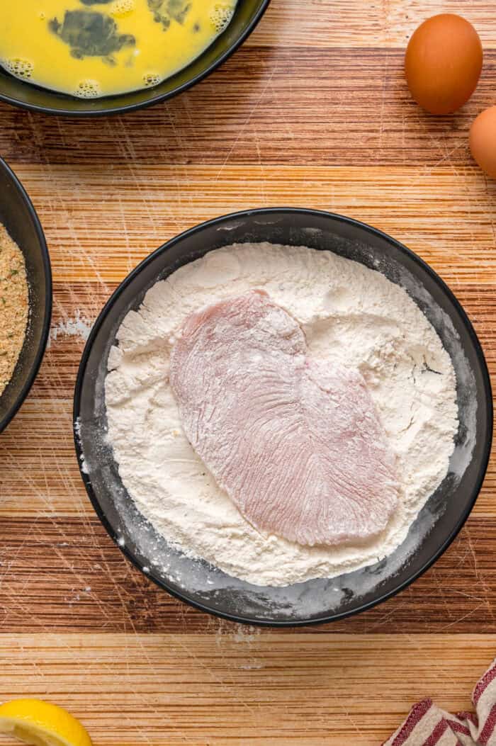 A chicken cutlet in flour