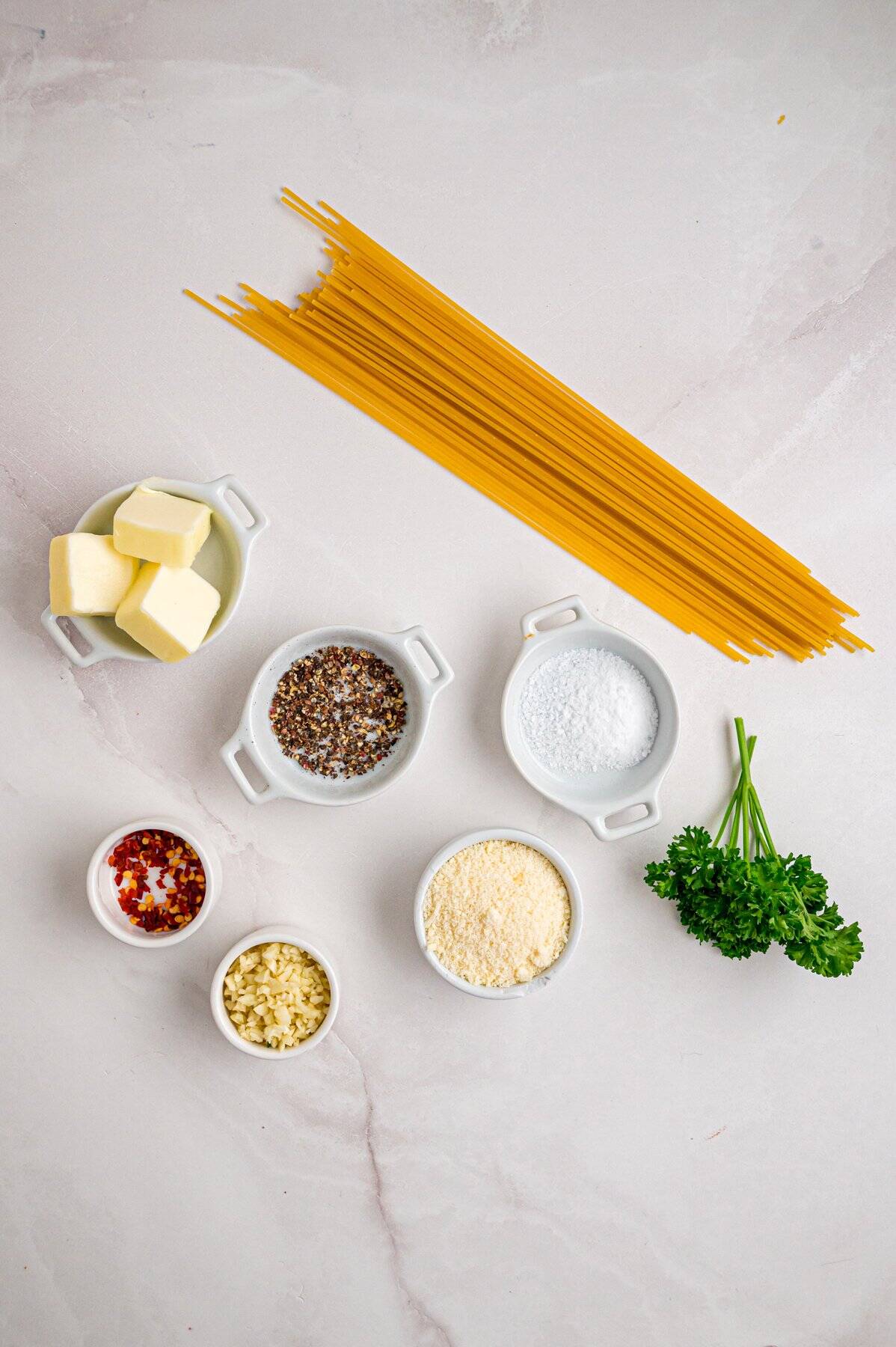 Overhead view of ingredients needed to make garlic butter noodles