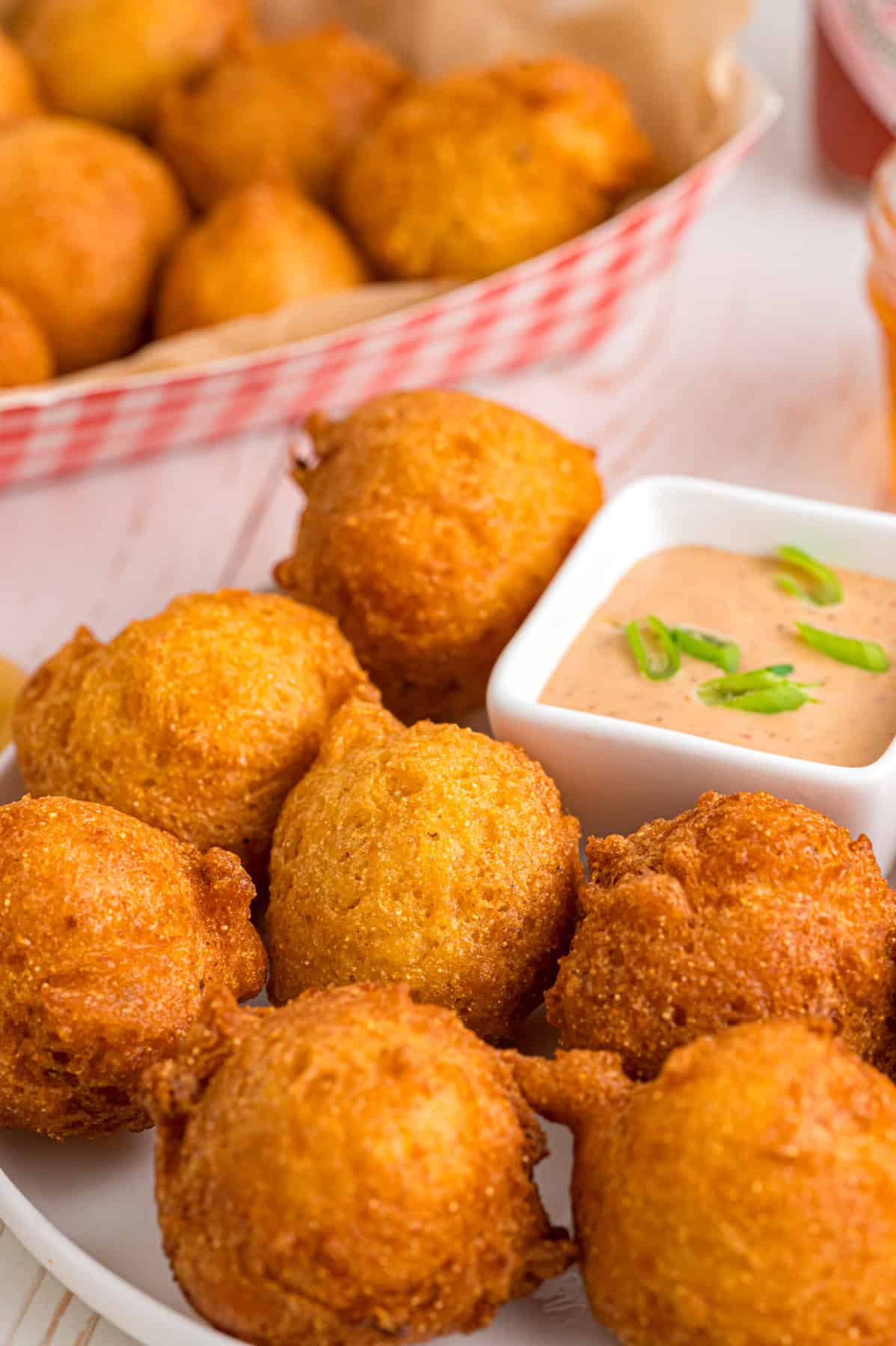 A plate of hush puppies with remoulade