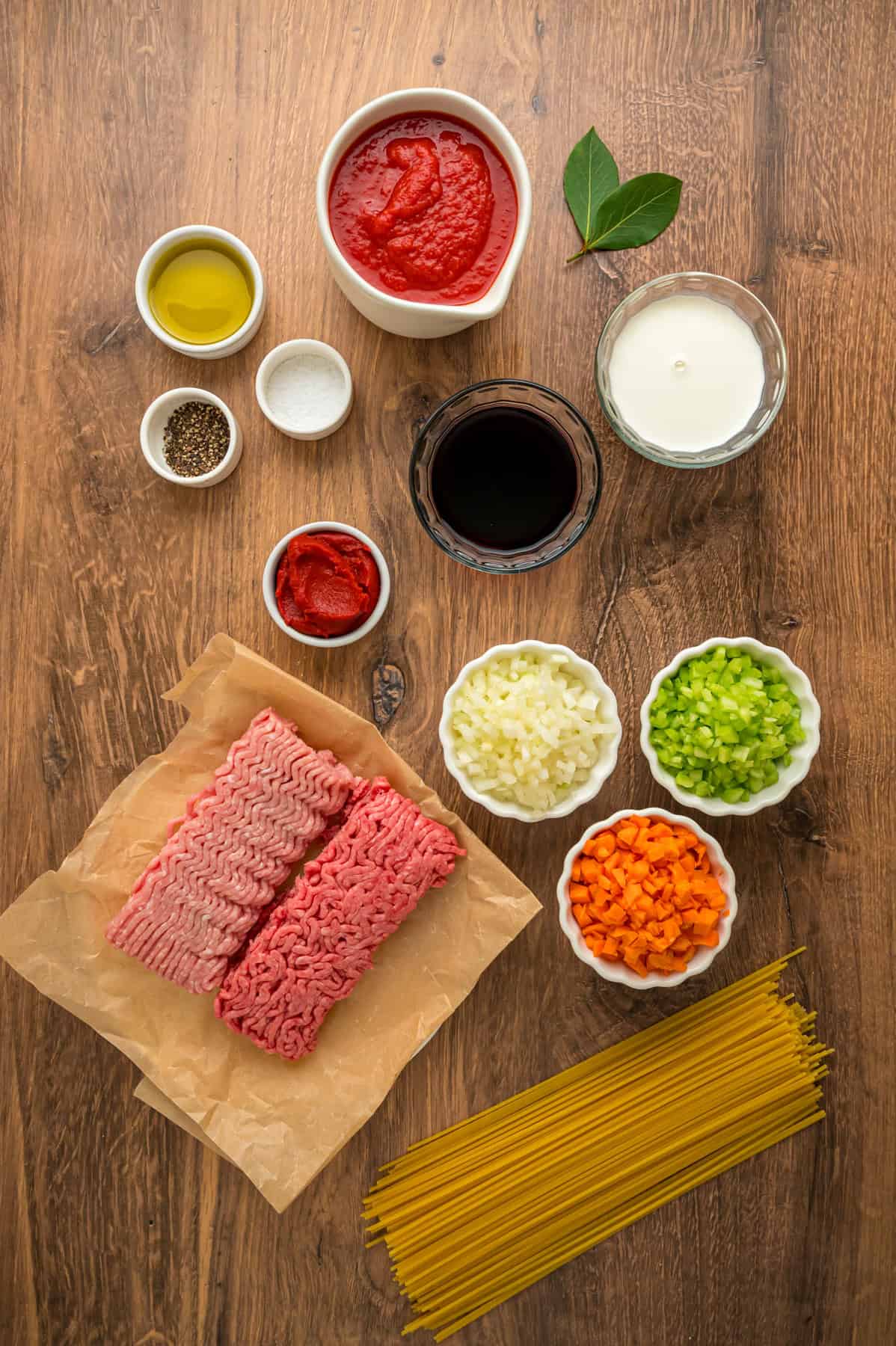 Overhead view of ingredients needed to make spaghetti bolognese