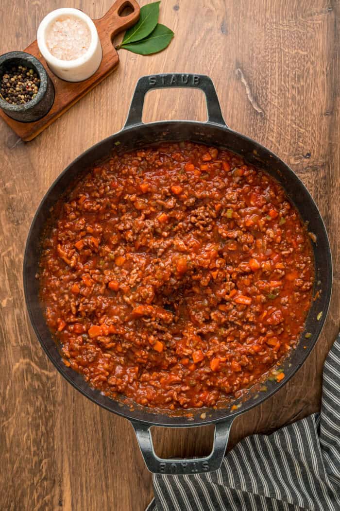Tomato sauce added to cooked ground meat