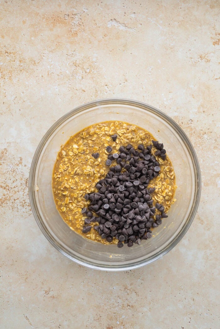 Folding chocolate chips into the oatmeal mixture