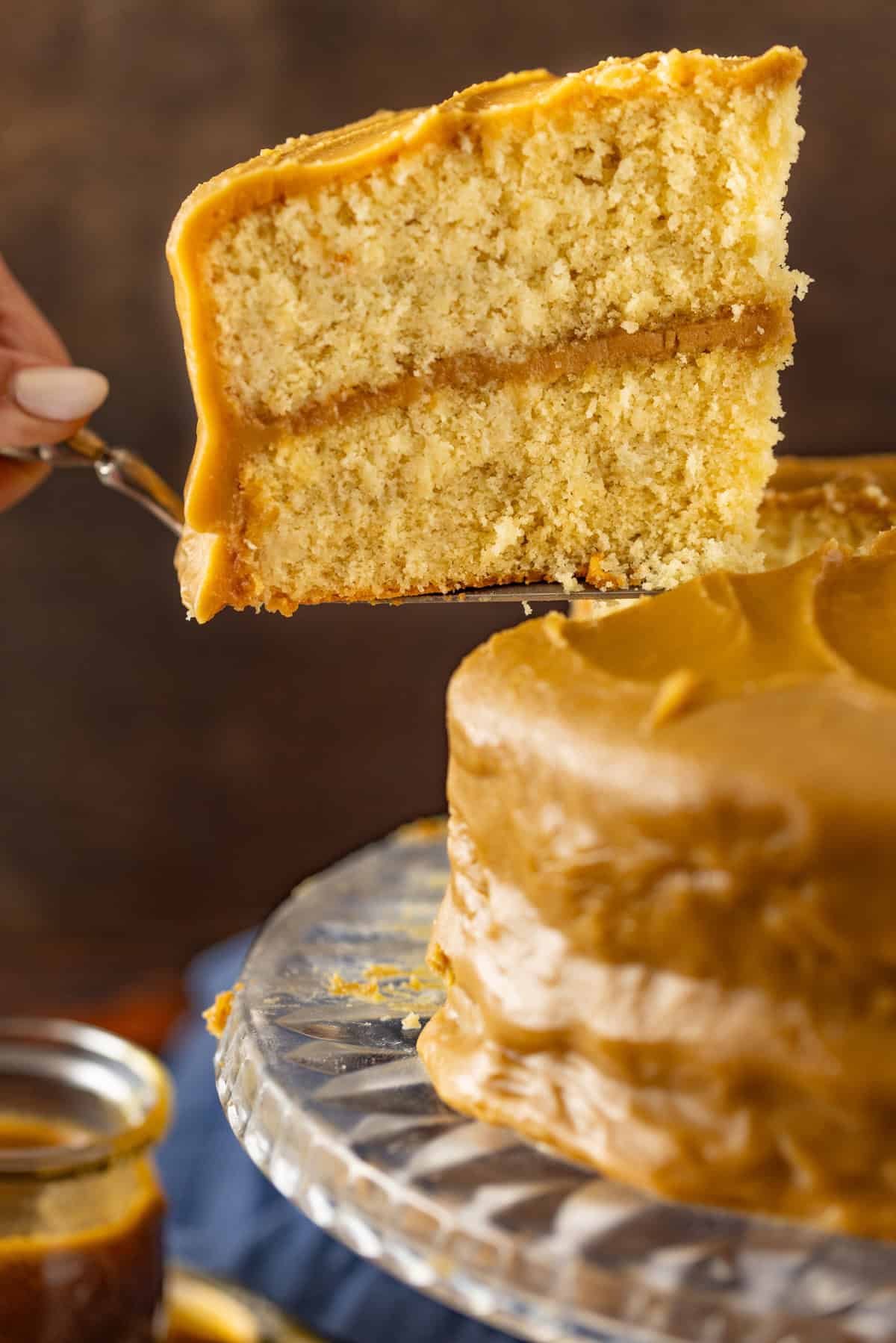Serving a slice of caramel cake