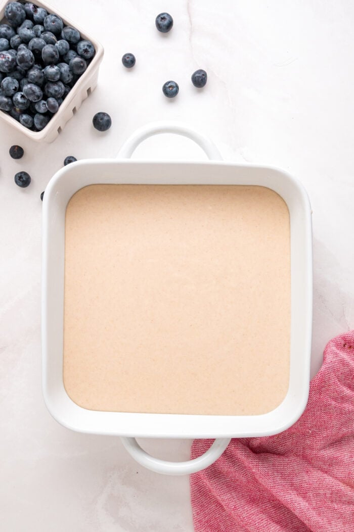 Cobbler crust batter in a baking dish