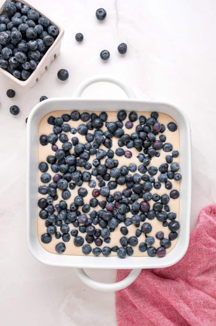 Blueberries on top of the batter