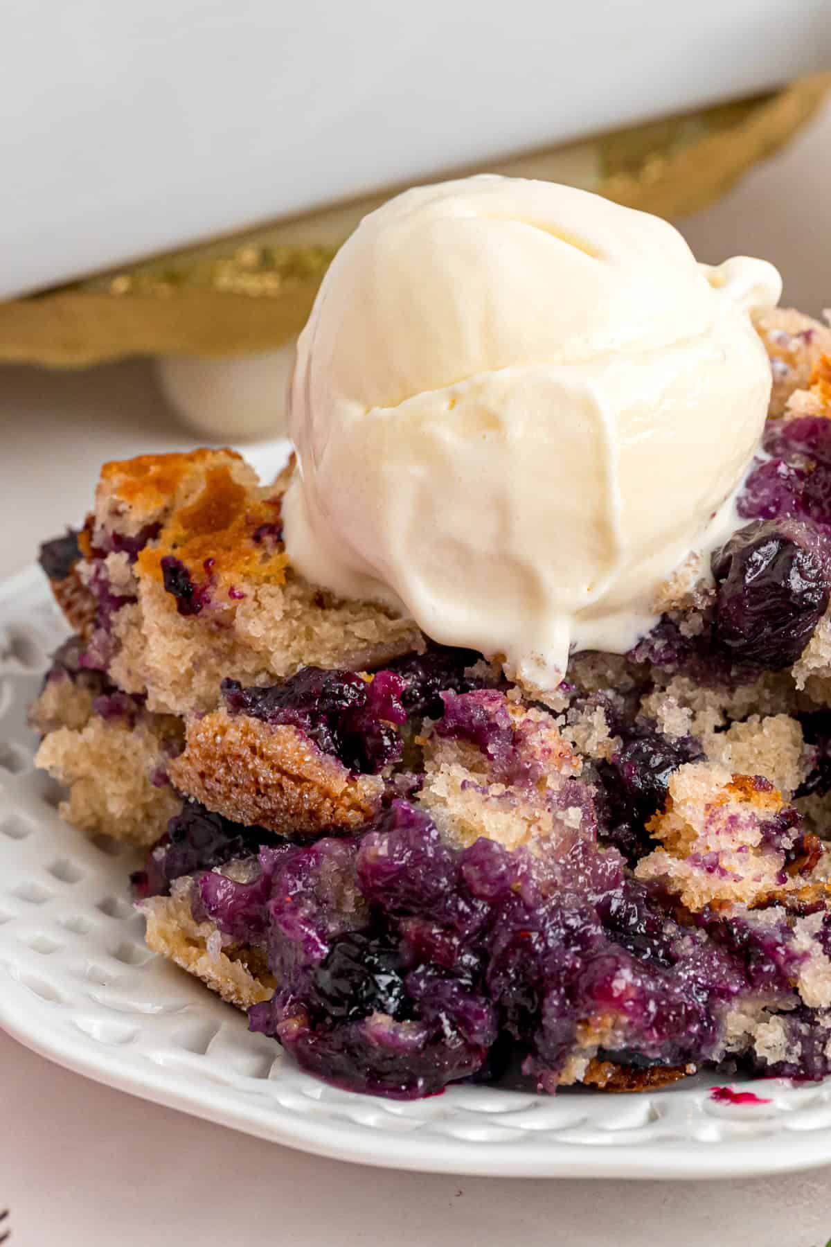 Blueberry Cobbler on a plate with ice cream