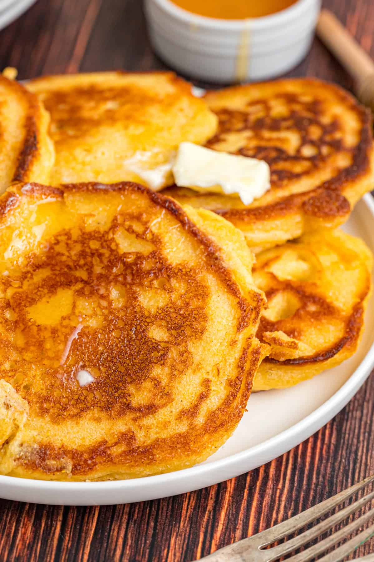 A plate of hoe cakes with butter