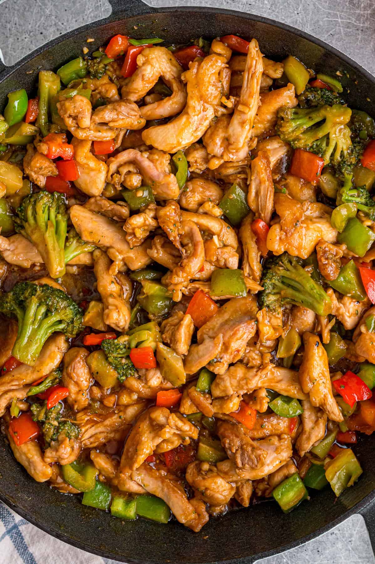 Overhead view of a skillet of Hunan chicken