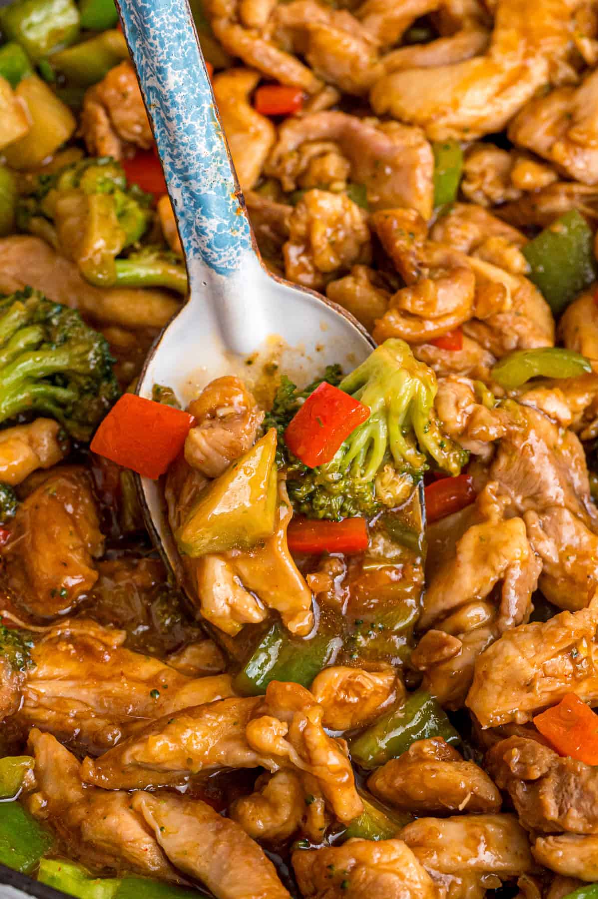 Close up of a spoon in Hunan chicken