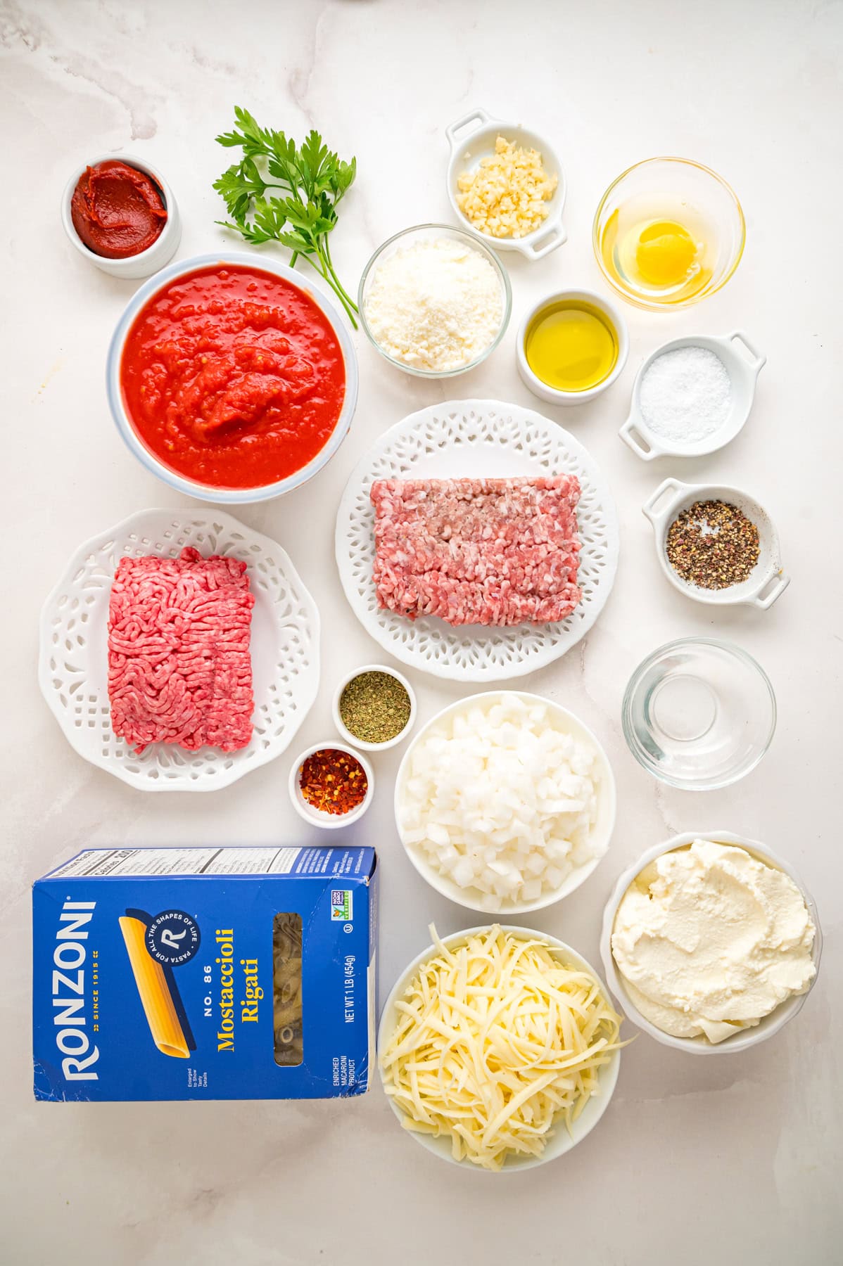 Overhead view of ingredients needed to make baked mostaccioli