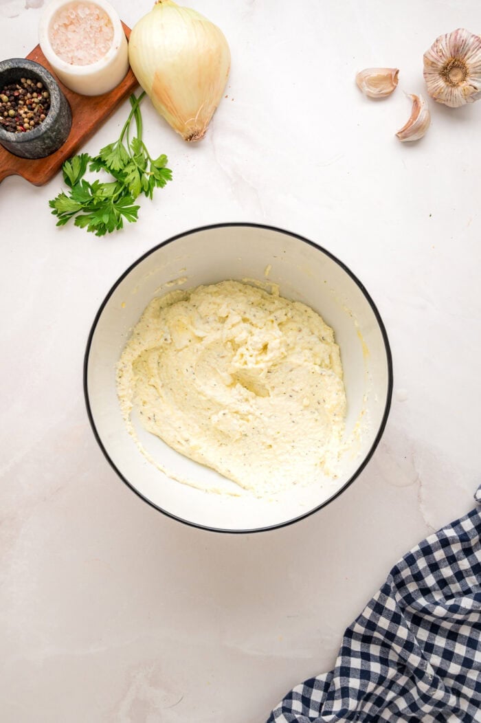 Combining the ricotta mixture ingredients in a bowl