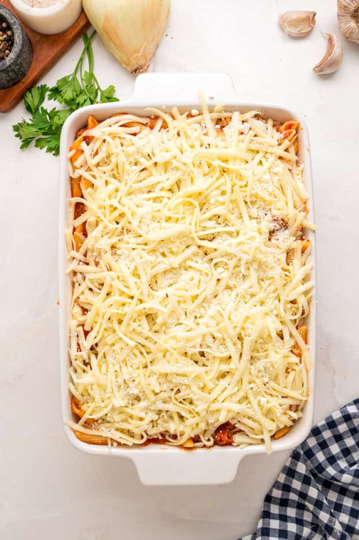 Unbaked mostaccioli in a baking dish