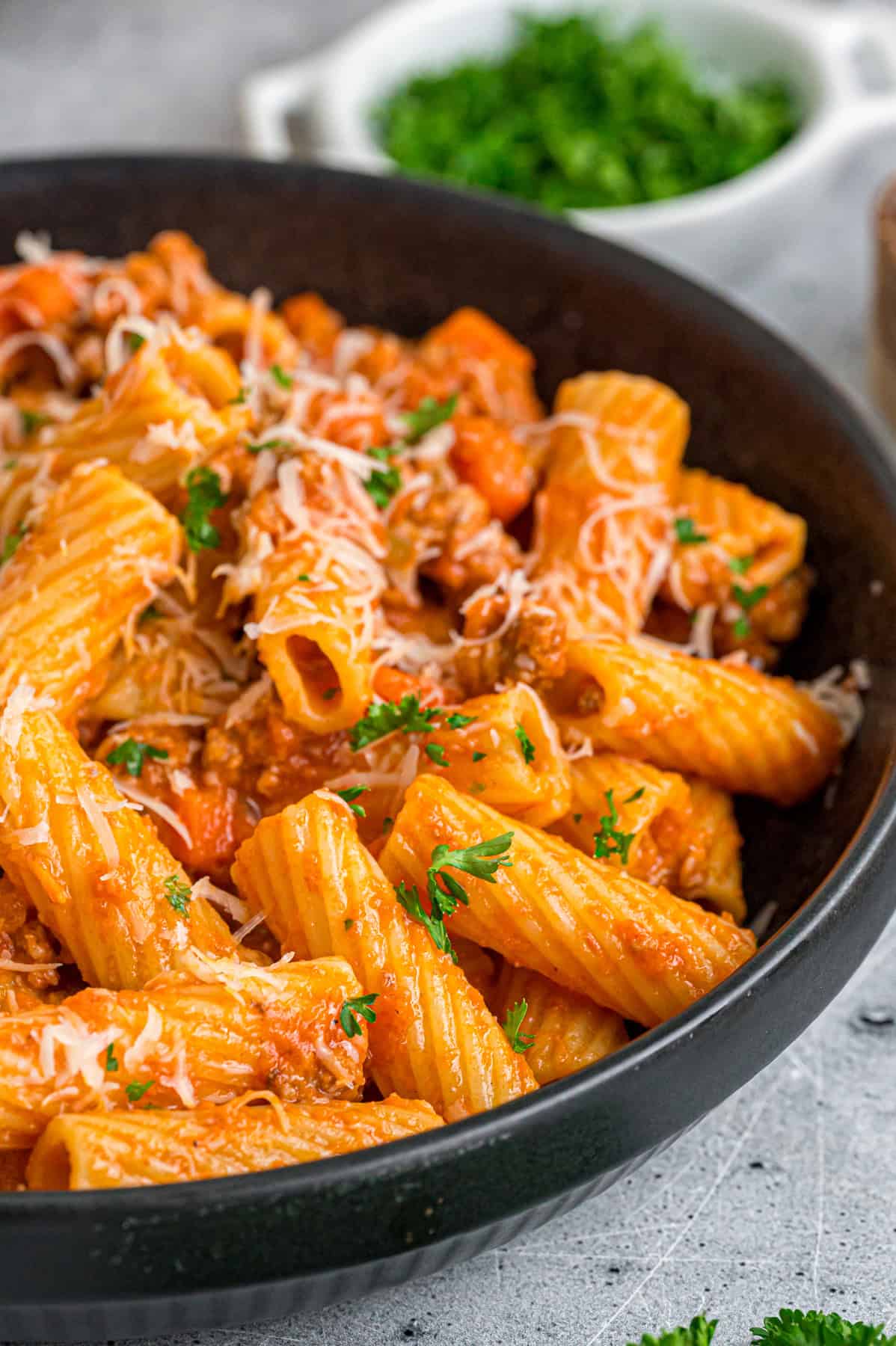 A bowl of rigatoni bolognese