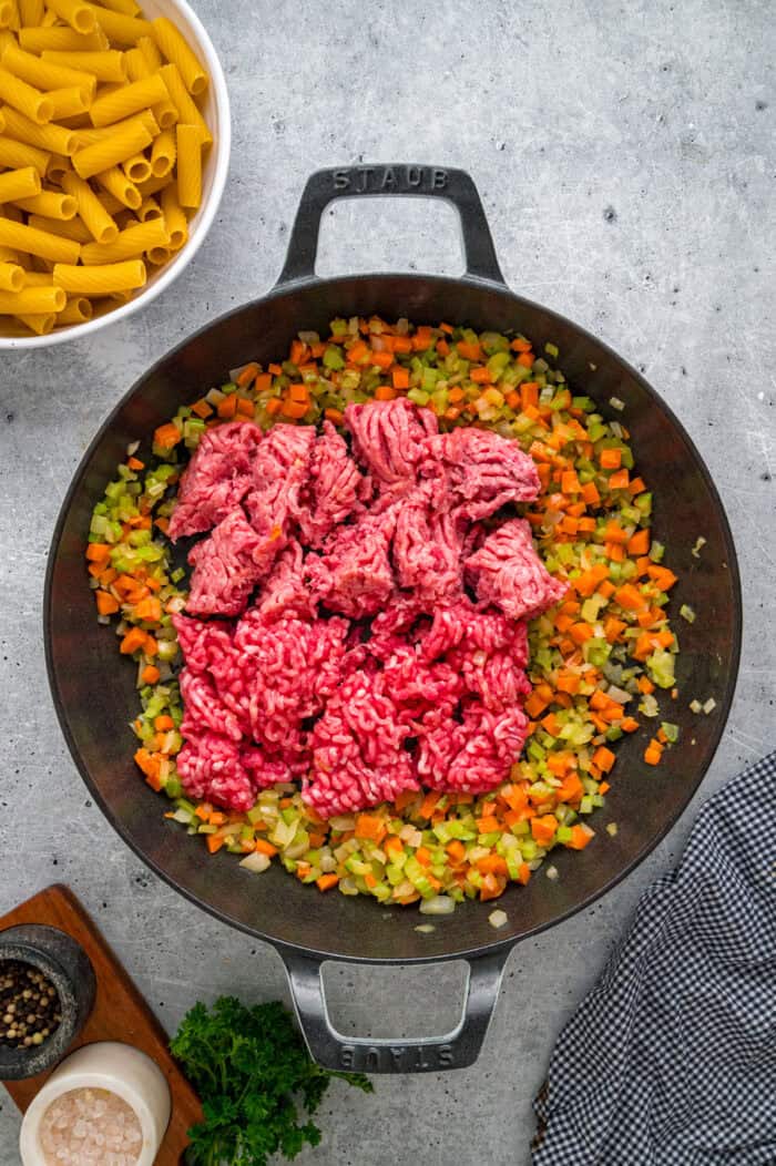 Ground pork and beef in a pan with sauteed veggies