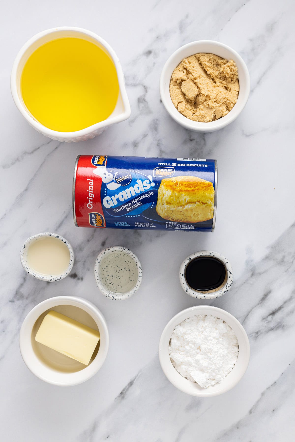 Soft, fluffy fried donuts are topped with a sweet maple frosting in this Maple Bars recipe. Quick & easy to make! Overhead view of ingredients needed to make maple bars