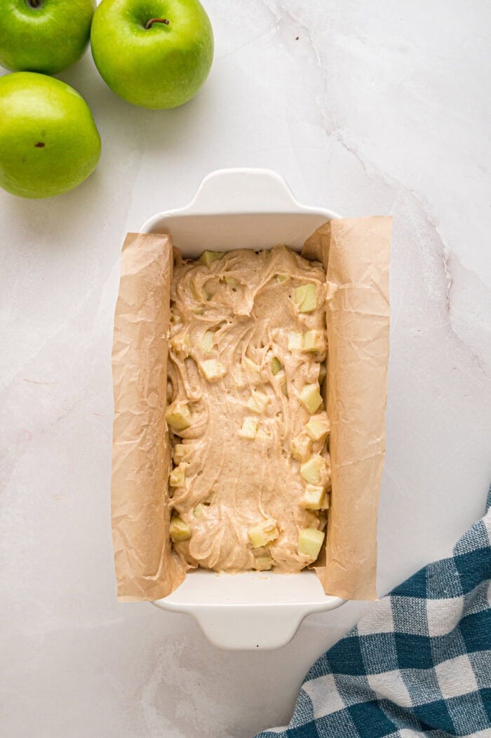 Apple cinnamon bread batter in a loaf pan