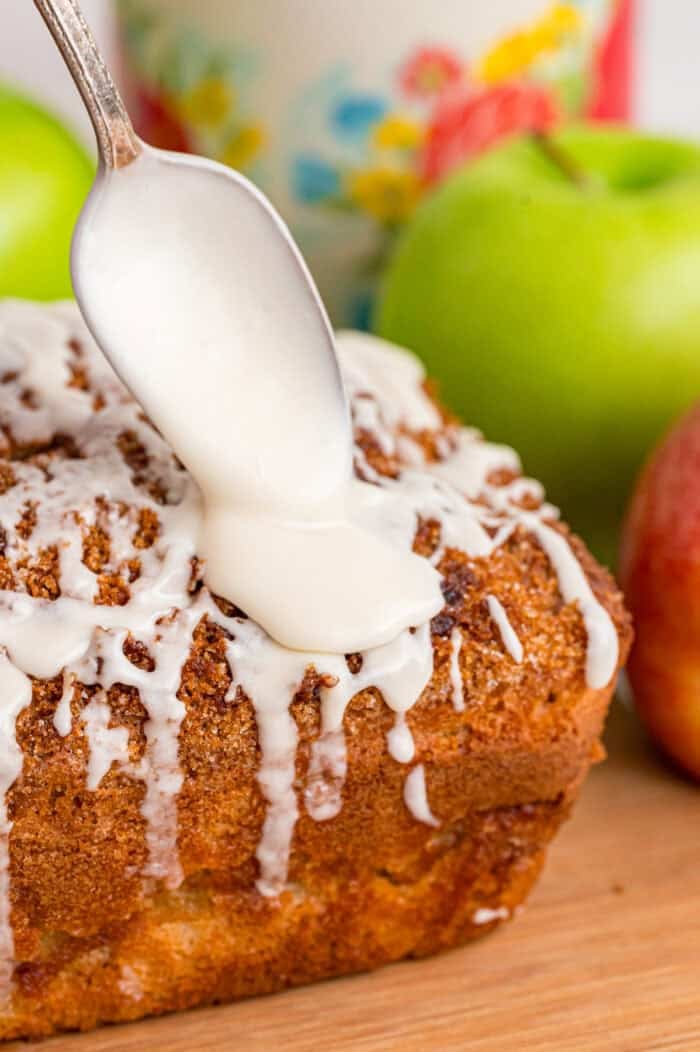 Drizzling glaze over apple cinnamon bread