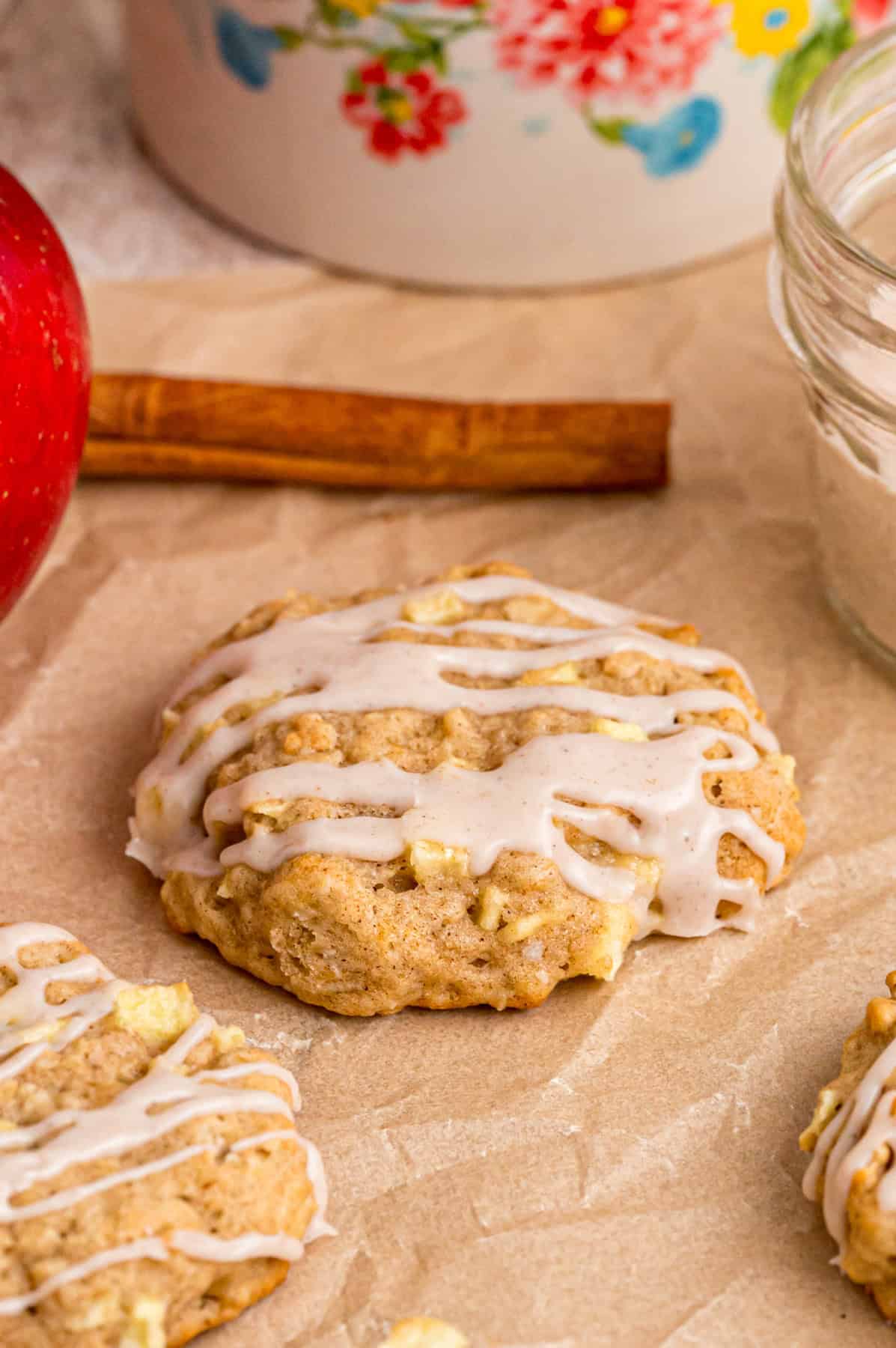 Glazed apple oatmeal cookies on parchment paper