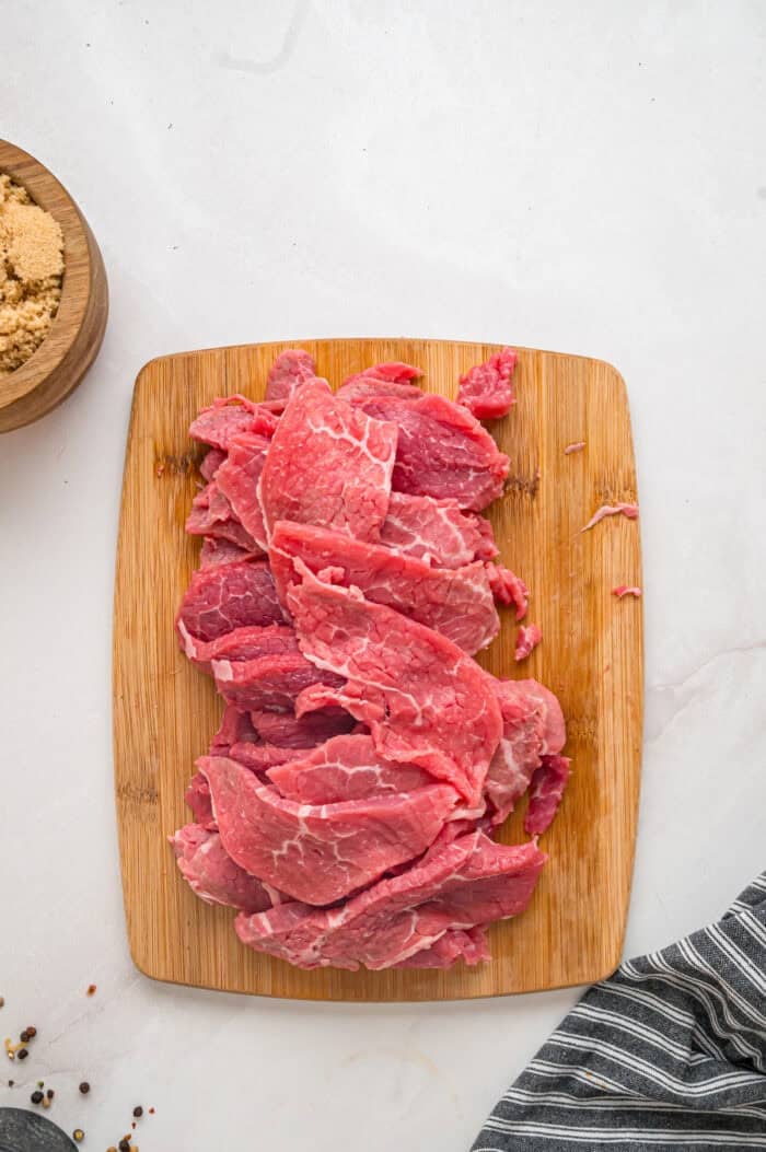 Eye of round roast cut into thin strips