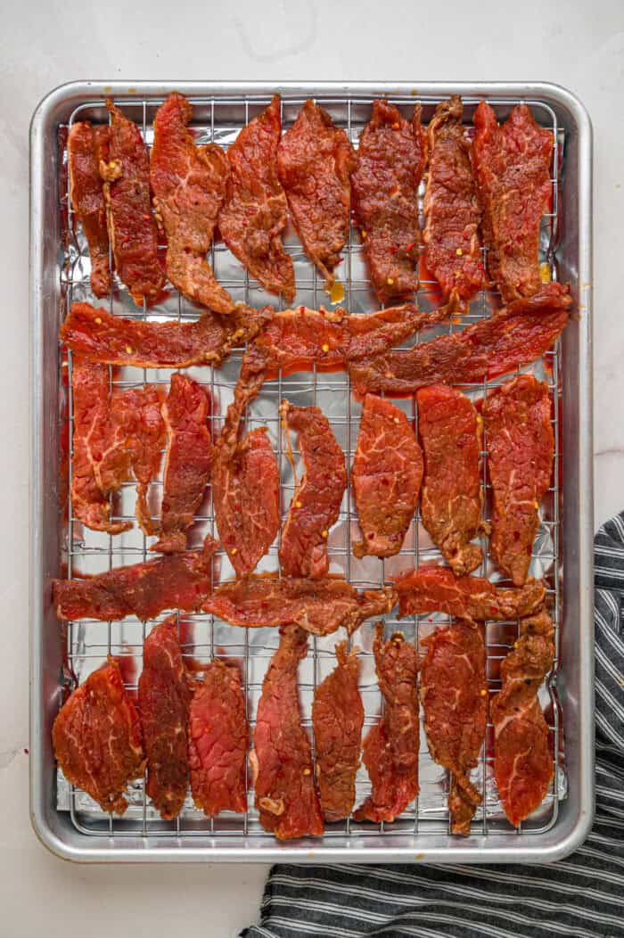 Beef jerky on a baking sheet