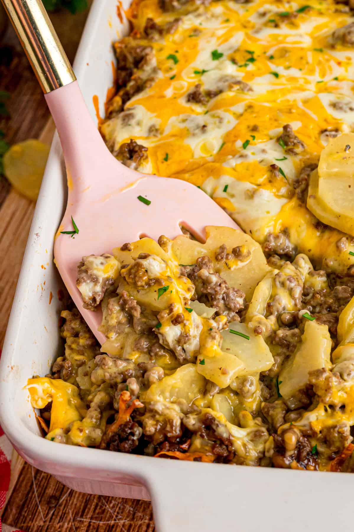 A spatula in hamburger potato casserole