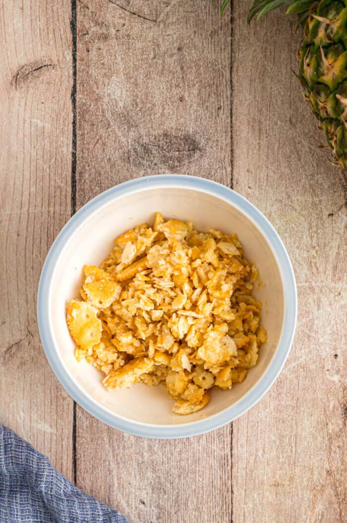 Cracker crumbs and butter in a bowl