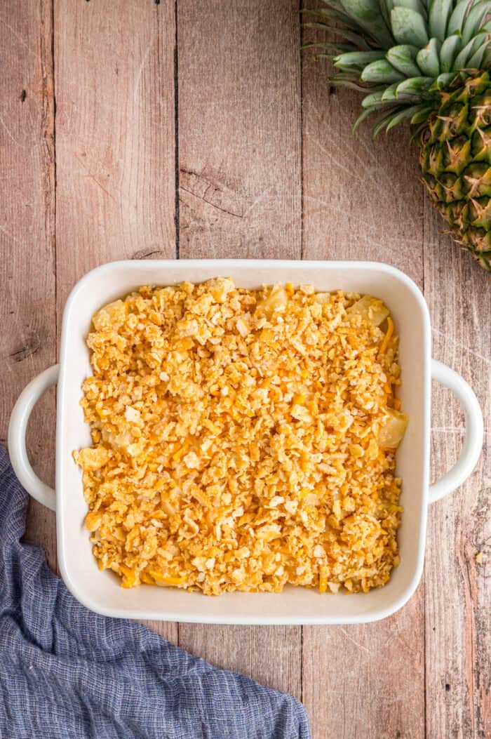 Ritz crumbs on pineapple in a casserole dish
