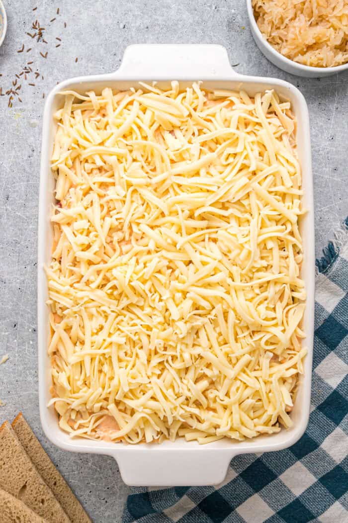 Shredded Swiss cheese on top of a casserole
