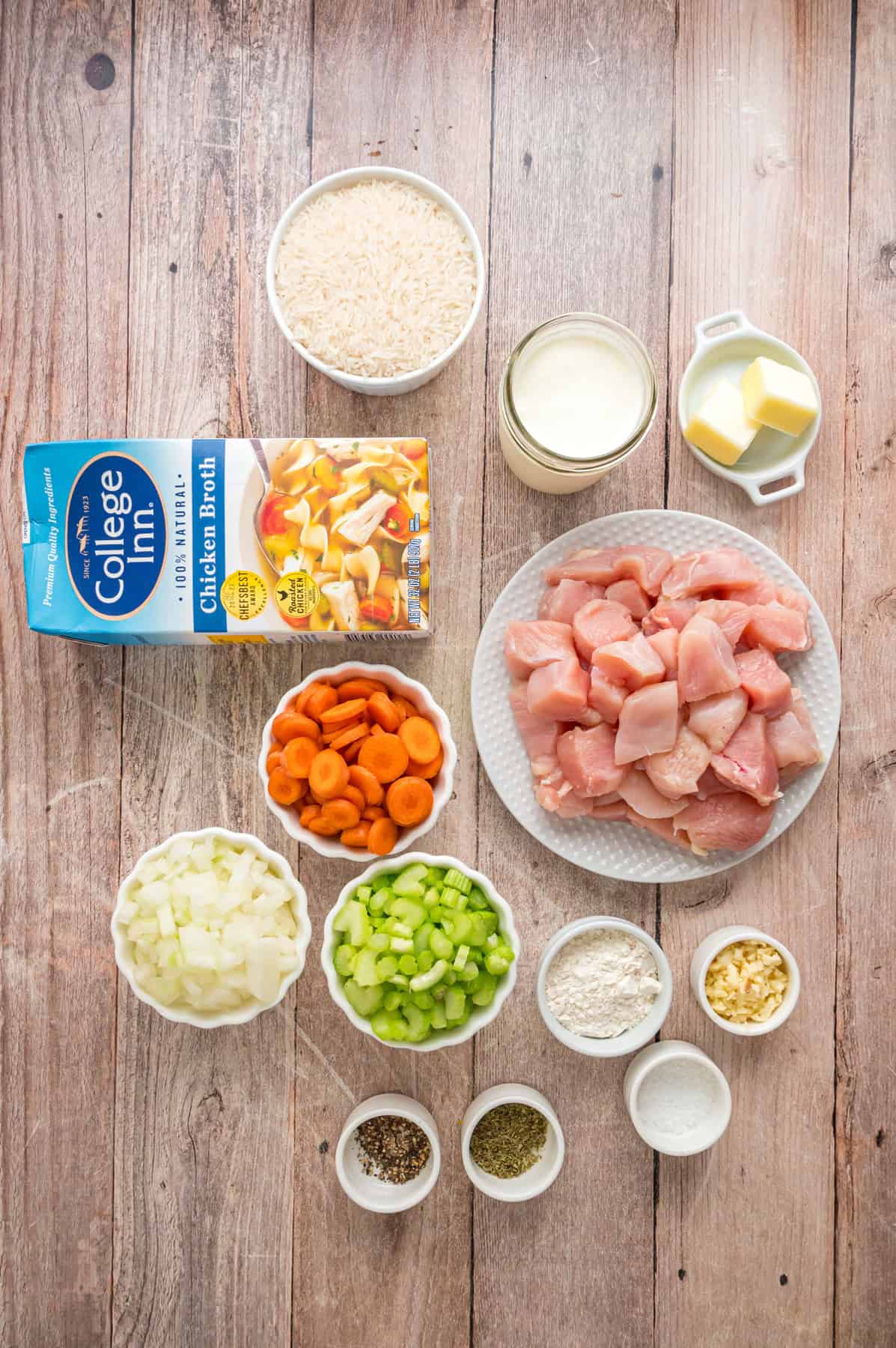 Ready in just under an hour, this Chicken and Rice Soup is quick, easy, and filling. Perfect for busy fall weeknights! Overhead view of ingredients needed to make chicken and rice soup