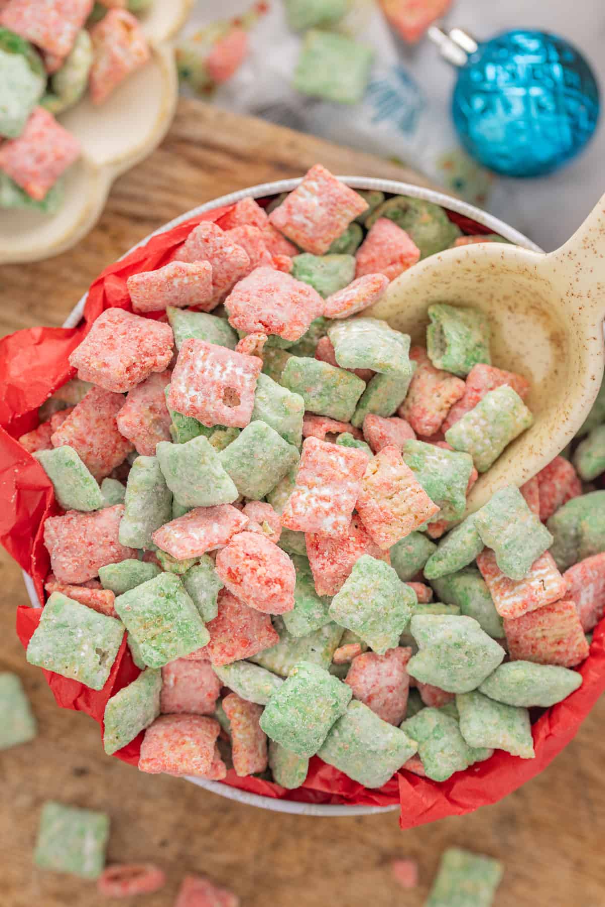 Scooping Christmas puppy chow from the bowl