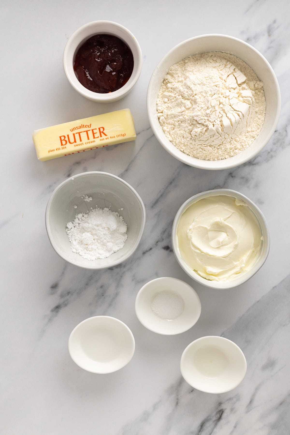 Kolaczki Cookies, aka Polish filled cookies, are made with a simple cream cheese dough and jam filling. They’re simple yet beautiful. Overhead view of ingredients needed to make kolaczki cookies