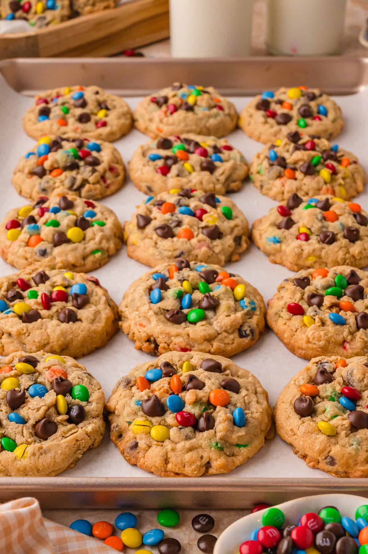 Overhead view of a baking sheet of monster cookies
